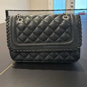 Black quilted purse similar to Chanel Flap Bag